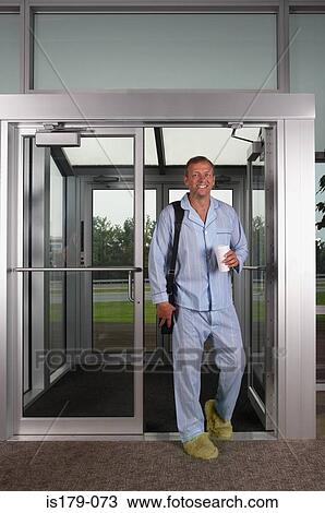 Stock Image - Businessman at work in his pajamas. Fotosearch