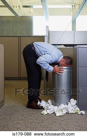 Businessman being sick in rubbish bin View Large Photo Image Stock Photo - Businessman being sick in rubbish bin. Fotosearch