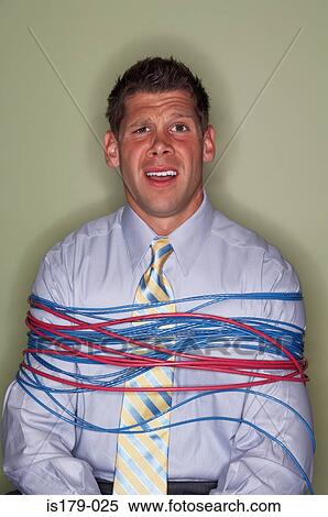 Stock Photography - Businessman bound with cables. Fotosearch