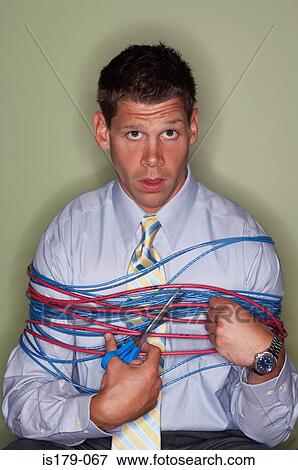 Stock Photo - Businessman bound with wires. Fotosearch