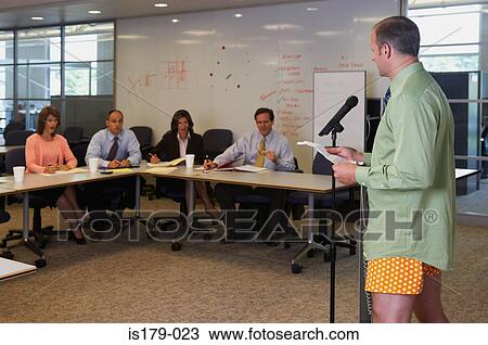 Stock Image - Businessman giving presentation in his underwear. Fotosearch