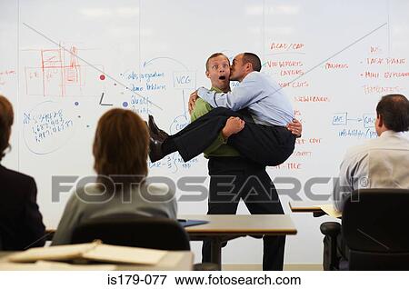 Stock Photo - Businessman in the arms of his boss. Fotosearch