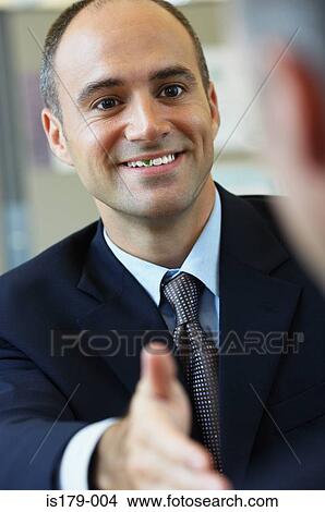 Businessman with food in his teeth View Large Photo Image Picture - Businessman with food in his teeth. Fotosearch