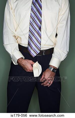 Businessman with his trouser zip undone View Large Photo Image Stock Photograph - Businessman with his trouser zip undone. Fotosearch