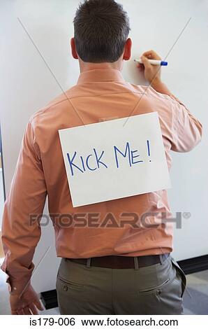 Stock Photograph - Businessman with kick me sign on his back. Fotosearch