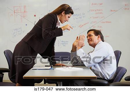 Stock Photo - Businesswoman shouting at colleague. Fotosearch