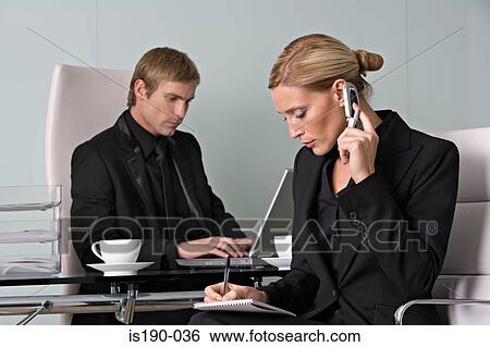 Businesspeople working View Large Photo Image Stock Photograph - Businesspeople working. Fotosearch