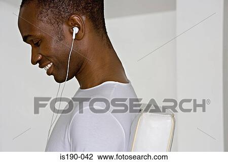 Man listening to music View Large Photo Image Stock Image - Man listening to music. Fotosearch