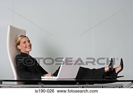 Relaxed businesswoman View Large Photo Image Stock Photograph - Relaxed businesswoman. Fotosearch