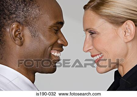 Smiling couple face to face View Large Photo Image Stock Image - Smiling couple face to face. Fotosearch
