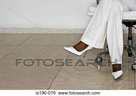 Woman wearing white View Large Photo Image Stock Photo - Woman wearing white. Fotosearch