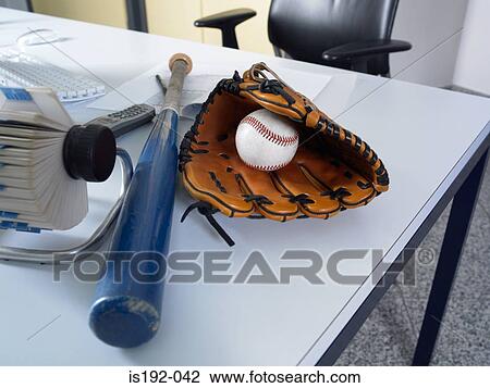 Baseball equipment on a desk View Large Photo Image Stock Image - Baseball equipment on a desk. Fotosearch