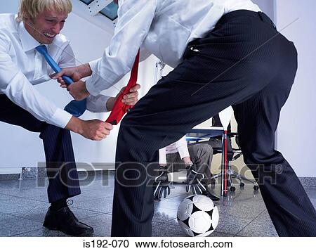 Businessmen fighting over football View Large Photo Image Stock Image - Businessmen fighting over football. Fotosearch