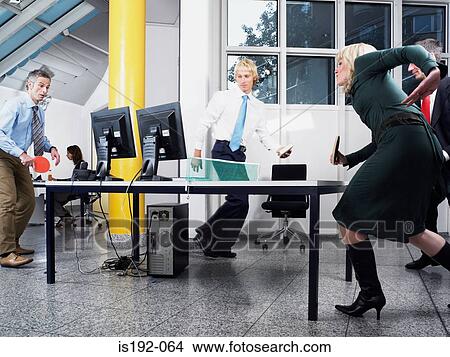 Colleagues playing table tennis View Large Photo Image Picture - Colleagues playing table tennis. Fotosearch