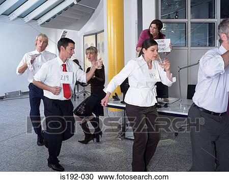 Colleagues running with drinks View Large Photo Image Stock Image - Colleagues running with drinks. Fotosearch