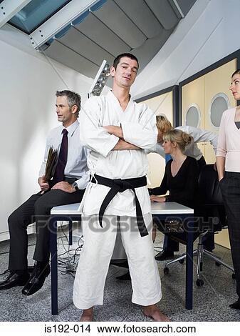 Picture - Karate instructor in office. Fotosearch