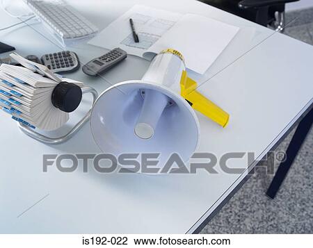 Stock Image - Megaphone on desk. Fotosearch