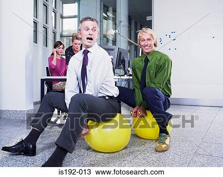 Stock Image - Office workers on hoppers. Fotosearch