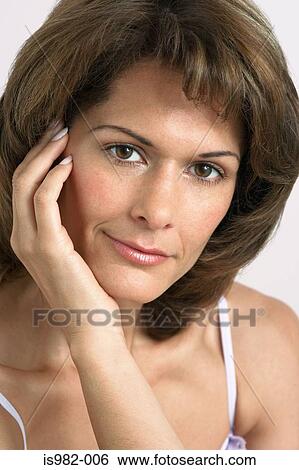 Portrait of mid adult woman View Large Photo Image Stock Photograph - Portrait of mid adult woman. Fotosearch