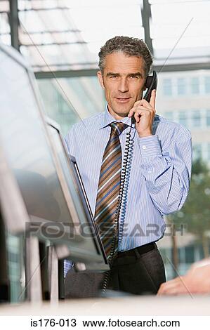 Businessman on the telephone View Large Photo Image Stock Image - Businessman on the telephone. Fotosearch