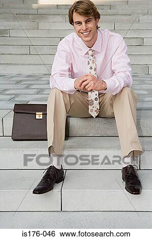 Businessman sitting on steps View Large Photo Image Stock Photograph - Businessman sitting on steps. Fotosearch