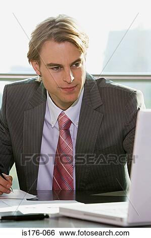 Businessman working View Large Photo Image Stock Photograph - Businessman working. Fotosearch