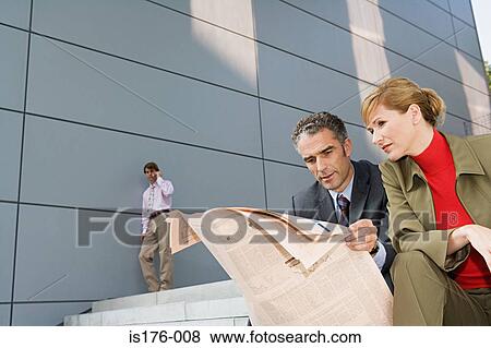 Stock Photo - Businesspeople outside office building. Fotosearch