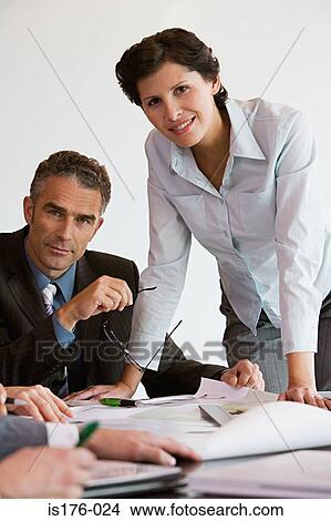 Businesspeople with plans View Large Photo Image Picture - Businesspeople with plans. Fotosearch