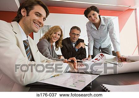 Businesspeople with plans View Large Photo Image Stock Photo - Businesspeople with plans. Fotosearch