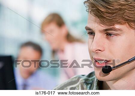 Stock Photo - Call centre worker. Fotosearch