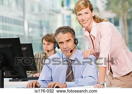 Stock Image - Call centre workers. Fotosearch
