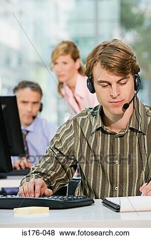 Call centre workers View Large Photo Image Stock Photo - Call centre workers. Fotosearch