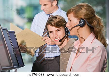 Call centre workers View Large Photo Image Stock Photo - Call centre workers. Fotosearch