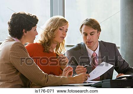 Colleagues having a discussion View Large Photo Image Stock Image - Colleagues having a discussion. Fotosearch