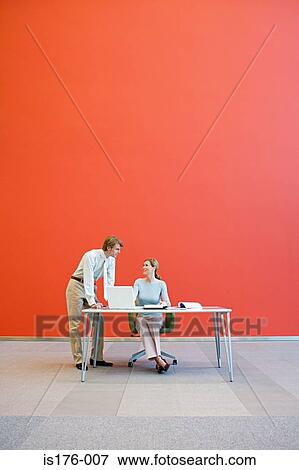 Colleagues in a spacious office View Large Photo Image Stock Photo - Colleagues in a spacious office. Fotosearch