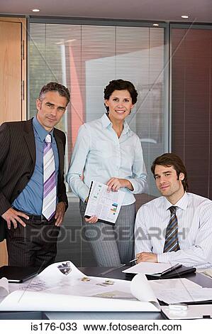 Colleagues with plans View Large Photo Image Stock Image - Colleagues with plans. Fotosearch