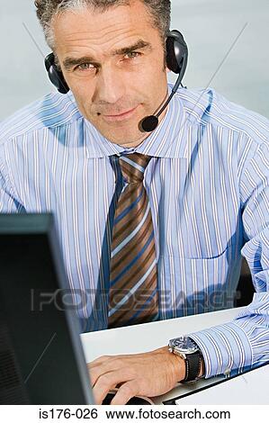 Man wearing telephone headset View Large Photo Image Stock Photograph - Man wearing telephone headset. Fotosearch