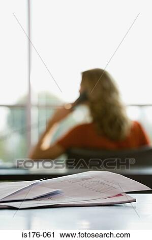 Paperwork and woman on the telephone View Large Photo Image Stock Image - Paperwork and woman on the telephone. Fotosearch