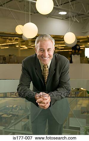 Businessman in office View Large Photo Image Stock Photo - Businessman in office. Fotosearch