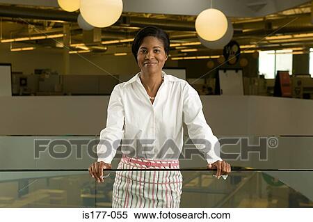 Businesswoman in office View Large Photo Image Stock Photography - Businesswoman in office. Fotosearch
