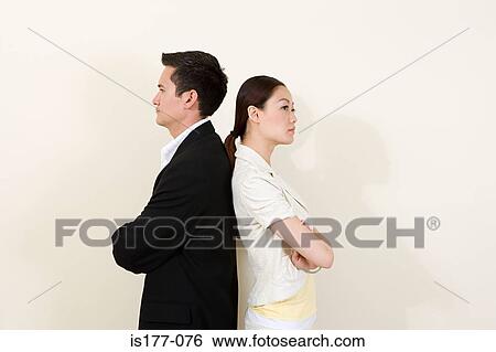 Office workers back to back View Large Photo Image Stock Photograph - Office workers back to back. Fotosearch
