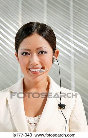 Woman wearing telephone headset View Large Photo Image Stock Image - Woman wearing telephone headset. Fotosearch