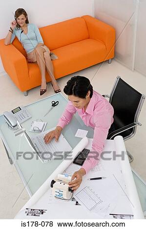 Stock Photo - Colleagues in an office. Fotosearch