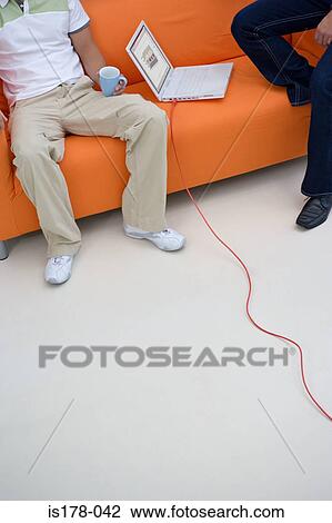 Colleagues on a sofa View Large Photo Image Stock Image - Colleagues on a sofa. Fotosearch