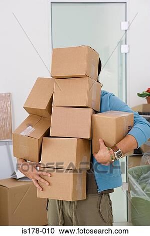 Man carrying boxes View Large Photo Image Stock Image - Man carrying boxes. Fotosearch
