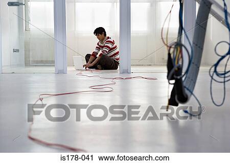 Man with laptop on floor View Large Photo Image Stock Image - Man with laptop on floor. Fotosearch
