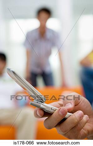 Person using mobile phone View Large Photo Image Stock Photograph - Person using mobile phone. Fotosearch