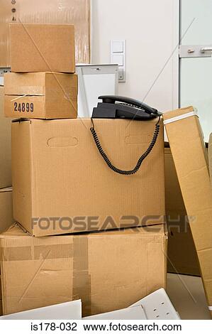 Telephone on cardboard boxes View Large Photo Image Stock Image - Telephone on cardboard boxes. Fotosearch
