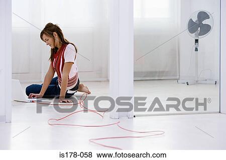 Woman with laptop in floor View Large Photo Image Stock Photo - Woman with laptop in floor. Fotosearch