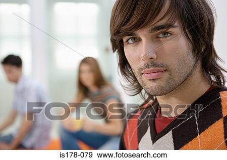 Stock Photo - Young man and colleagues. Fotosearch